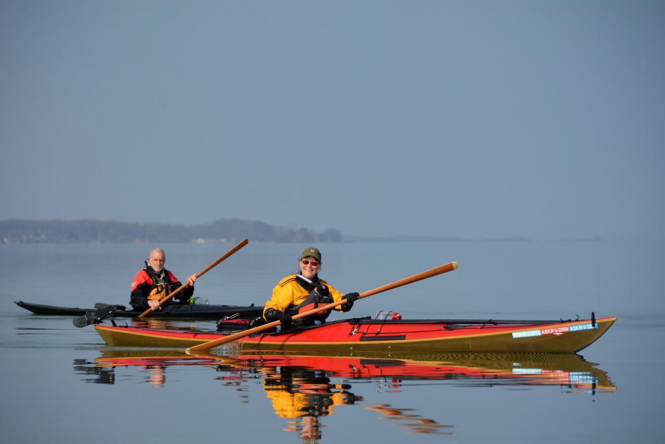 two people sailing a kayak